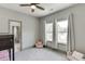 Bedroom with bunk beds and carpeted floors featuring natural light from two windows at 4208 Sierra Creek Ct, Hoschton, GA 30548
