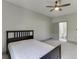 This bedroom features an adjoining bathroom with a carpeted floor at 4208 Sierra Creek Ct, Hoschton, GA 30548