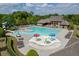 Community pool featuring a large swimming area, slides, sun umbrellas, and plenty of lounging chairs at 4208 Sierra Creek Ct, Hoschton, GA 30548