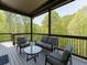 Deck with seating area overlooks beautiful greenery at 4208 Sierra Creek Ct, Hoschton, GA 30548
