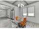 Dining room featuring a glass top table with seating for four and decorative windows at 4208 Sierra Creek Ct, Hoschton, GA 30548