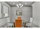 Dining room featuring a glass top table with seating for four and modern chandelier at 4208 Sierra Creek Ct, Hoschton, GA 30548