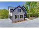 A beautiful two-story home featuring neutral brickwork, a two-car garage, and a well-manicured lawn at 4208 Sierra Creek Ct, Hoschton, GA 30548
