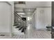 Bright foyer featuring wood-look floors, coffered ceilings, iron stair railings at 4208 Sierra Creek Ct, Hoschton, GA 30548