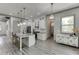 Modern kitchen with island, stainless appliances, and an open view to the pantry and living spaces at 4208 Sierra Creek Ct, Hoschton, GA 30548