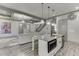 Open concept kitchen with stainless steel appliances, island and view to living room at 4208 Sierra Creek Ct, Hoschton, GA 30548