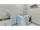 This laundry room features modern appliances and stylish marble accents at 4208 Sierra Creek Ct, Hoschton, GA 30548