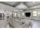 Open-concept living area that connects to a modern kitchen with stainless steel appliances at 4208 Sierra Creek Ct, Hoschton, GA 30548