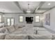 Spacious living area with a fireplace, large windows, and a contemporary design at 4208 Sierra Creek Ct, Hoschton, GA 30548
