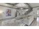 Living room featuring a sectional couch, fireplace, and an art piece at 4208 Sierra Creek Ct, Hoschton, GA 30548