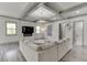 Beautiful living room boasts a coffered ceiling, fireplace, and stylish decor at 4208 Sierra Creek Ct, Hoschton, GA 30548