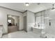 Bright bathroom featuring a soaking tub, frameless shower, and modern fixtures at 4208 Sierra Creek Ct, Hoschton, GA 30548