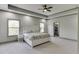 Spacious main bedroom featuring tray ceiling, neutral paint, and ample natural light at 4208 Sierra Creek Ct, Hoschton, GA 30548