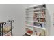 Walk-in pantry with multiple shelves at 4208 Sierra Creek Ct, Hoschton, GA 30548
