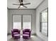 Cozy sitting area with two chairs and large windows providing natural light at 4208 Sierra Creek Ct, Hoschton, GA 30548