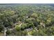 Picturesque neighborhood with lush greenery, well-spaced homes, and a tranquil pond nestled among the trees at 5641 Roberts Dr, Dunwoody, GA 30338