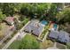 Charming home with a well-manicured lawn and a private pool, complemented by the surrounding greenery and mature trees at 5641 Roberts Dr, Dunwoody, GA 30338