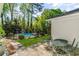 Backyard featuring patio, lush landscaping and wrought iron fence surrounding inground pool at 5641 Roberts Dr, Dunwoody, GA 30338