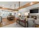 Expansive great room with vaulted ceilings, wood beams, stone fireplace, and an open kitchen at 5641 Roberts Dr, Dunwoody, GA 30338