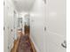 Hallway with a decorative rug leading to various rooms at 5641 Roberts Dr, Dunwoody, GA 30338