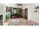 Cozy living room featuring a stylish fireplace, dark green walls, and built-in bookshelves at 5641 Roberts Dr, Dunwoody, GA 30338