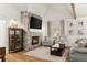 Stylish living room with a stone fireplace, neutral color palette, and ample natural light at 5641 Roberts Dr, Dunwoody, GA 30338