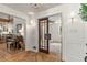 Open-concept design with a cozy fireplace and a view of the elegant dining room and foyer at 5641 Roberts Dr, Dunwoody, GA 30338