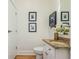 Bathroom features a granite countertop, decorative mirror, and modern finishes at 1253 Caroline Ne St # 229, Atlanta, GA 30307