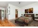 Bright bedroom with modern furnishings, light hardwood floors, and ensuite bathroom at 1253 Caroline Ne St # 229, Atlanta, GA 30307