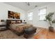 Comfortable bedroom with neutral tones, a padded bench, and light-filled windows at 1253 Caroline Ne St # 229, Atlanta, GA 30307
