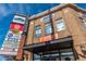 Exterior of a building with prominent signs for various retailers and businesses at 1253 Caroline Ne St # 229, Atlanta, GA 30307