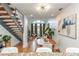 Open-concept dining and living room with modern lighting, hardwood floors, and staircase at 1253 Caroline Ne St # 229, Atlanta, GA 30307