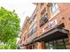 Commercial building exterior showing shops with brick facade and black awnings at 1253 Caroline Ne St # 229, Atlanta, GA 30307