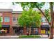 Charming brick building exterior featuring a mix of shops and restaurants at 1253 Caroline Ne St # 229, Atlanta, GA 30307