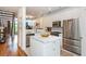 Bright kitchen features stainless steel appliances, white cabinets, marble countertops, and a stylish island at 1253 Caroline Ne St # 229, Atlanta, GA 30307