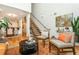 Open-concept living area featuring hardwood floors, exposed staircase, and lots of natural light at 1253 Caroline Ne St # 229, Atlanta, GA 30307