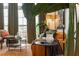 Cozy living room with leather sofa, eclectic decor, and views of the balcony at 1253 Caroline Ne St # 229, Atlanta, GA 30307