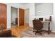 Dedicated office area with a rustic desk and easy access to the ensuite bathroom at 1253 Caroline Ne St # 229, Atlanta, GA 30307