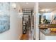 Stylish staircase ascending to second floor, next to a kitchen with granite countertops at 1253 Caroline Ne St # 229, Atlanta, GA 30307
