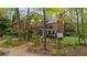 A beautiful brick home featuring a charming backyard with a well-maintained lawn and a relaxing hot tub at 1410 Daley Ridge Ct, Lawrenceville, GA 30045