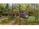 A beautiful brick home featuring a charming backyard with a well-maintained lawn and a relaxing hot tub at 1410 Daley Ridge Ct, Lawrenceville, GA 30045