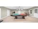 Spacious basement featuring a billiard table, exercise equipment, and ample room for recreation and entertainment at 1410 Daley Ridge Ct, Lawrenceville, GA 30045