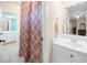 Bathroom featuring a white vanity and a shower/tub combo at 1410 Daley Ridge Ct, Lawrenceville, GA 30045