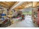 Garage with tools, equipment and an open garage door at 1410 Daley Ridge Ct, Lawrenceville, GA 30045