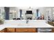 Spacious kitchen with white countertops and cabinetry that opens to the living room creating an open concept at 1410 Daley Ridge Ct, Lawrenceville, GA 30045