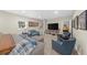 Carpeted living room with neutral paint, a TV, and furnishings at 1410 Daley Ridge Ct, Lawrenceville, GA 30045