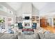 Cozy living room with fireplace, built-in shelving and ample seating at 1410 Daley Ridge Ct, Lawrenceville, GA 30045