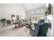 Bright living room with high vaulted ceilings, French doors, neutral tones and cozy furnishings at 1410 Daley Ridge Ct, Lawrenceville, GA 30045