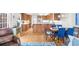 Open-concept kitchen, dining, and living room with hardwood floors, stainless steel appliances and lots of natural light at 1410 Daley Ridge Ct, Lawrenceville, GA 30045