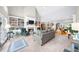 Spacious living room with fireplace, built-in shelves and open access to dining room at 1410 Daley Ridge Ct, Lawrenceville, GA 30045
